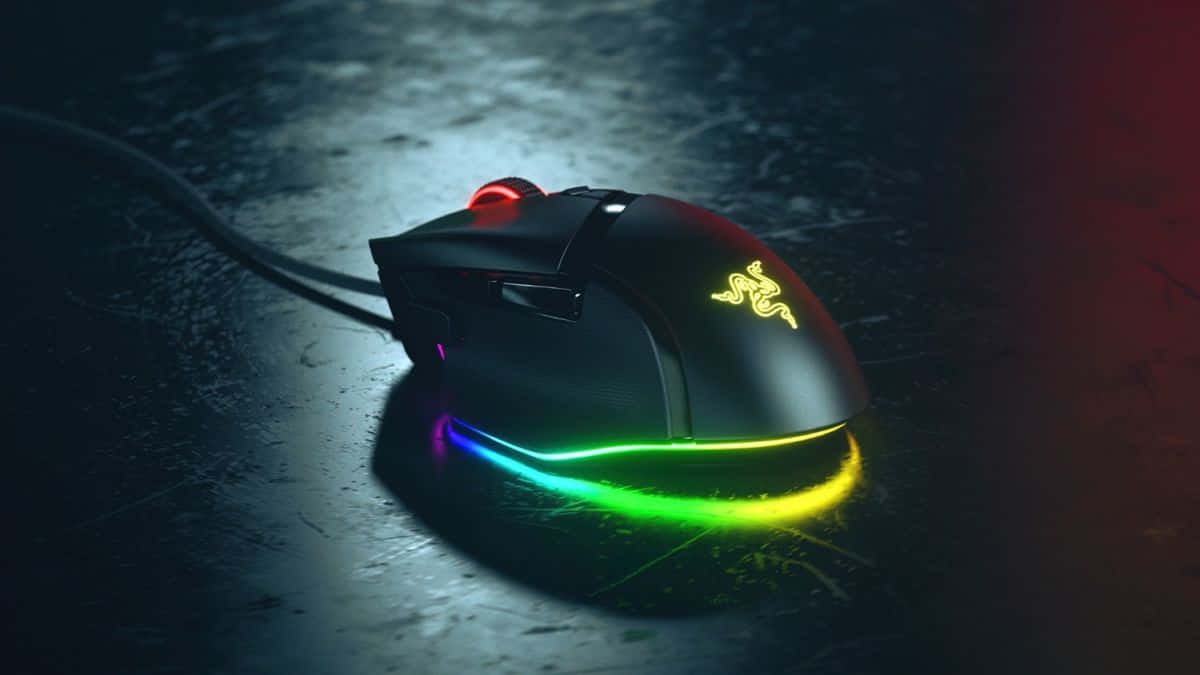Professional Gaming Mouse on a Colorful LED Mousepad Wallpaper