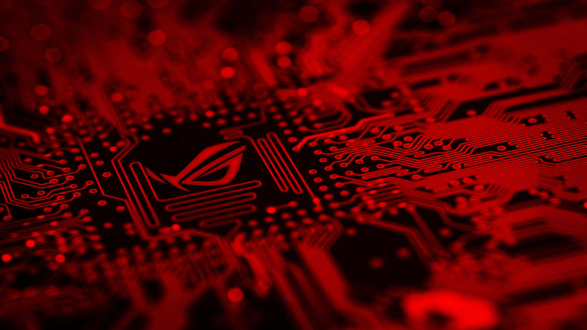 A Red Circuit Board With A Red Logo