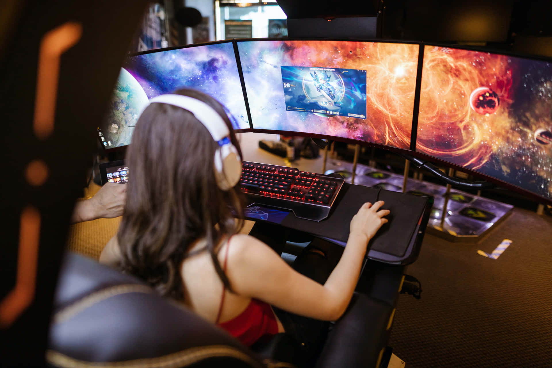 A Woman Is Playing A Game On A Computer