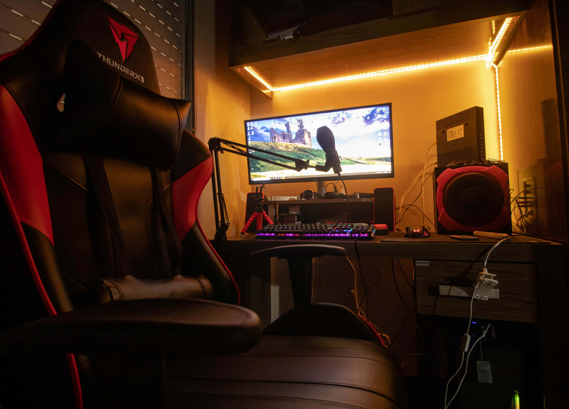 A Gaming Chair With A Monitor And Speakers