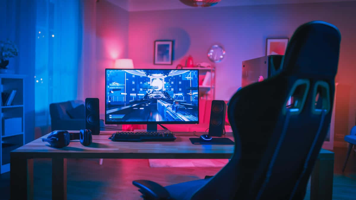 Enjoy Immersive Gaming with this State-of-the-Art PC Setup Wallpaper