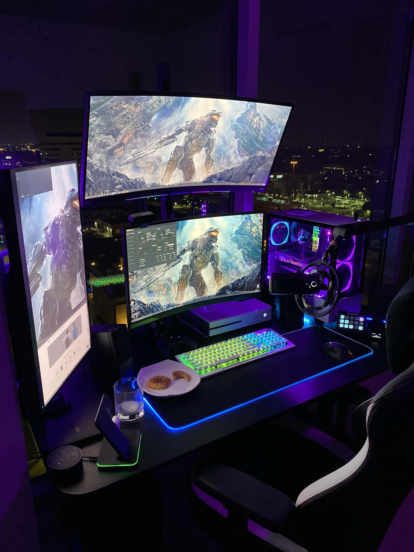 A powerful gaming PC setup with graphics card and triple monitors. Wallpaper