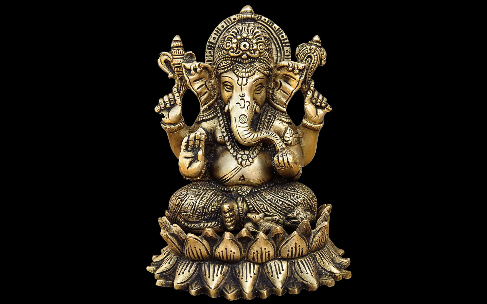 A Gold Ganesha Statue On A Black Background