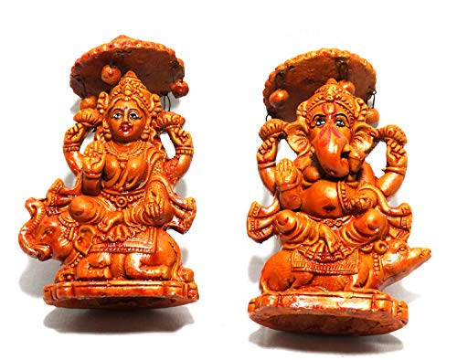 Estatuasde Bronce Y Arcilla De Ganesh Y Lakshmi Para Fondos De Pantalla De Computadora O Móvil. Fondo de pantalla