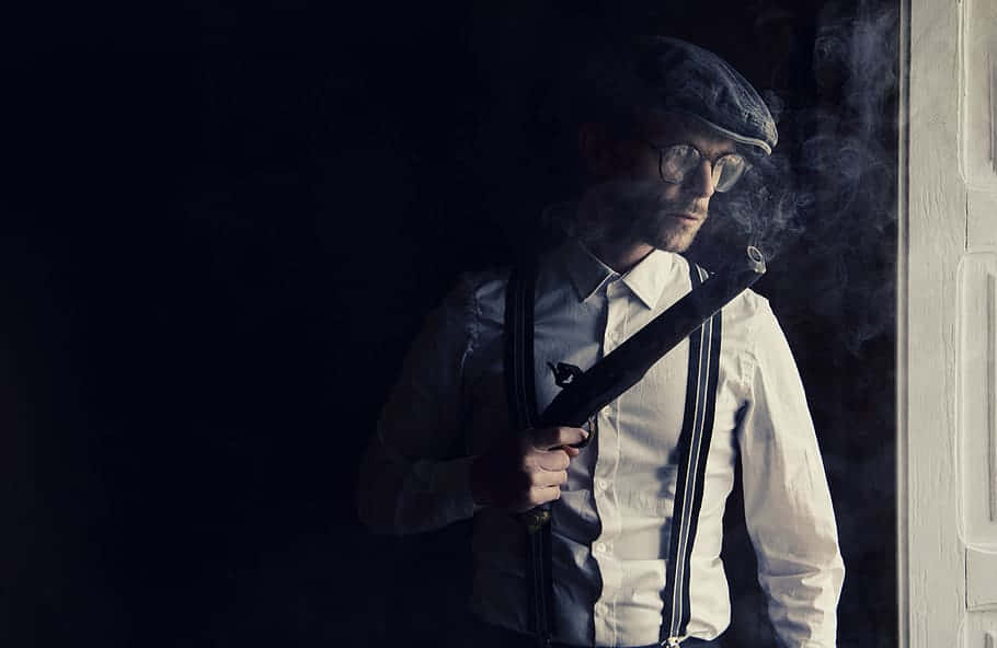 Gangster With Guns Wearing Vintage Outfit Wallpaper