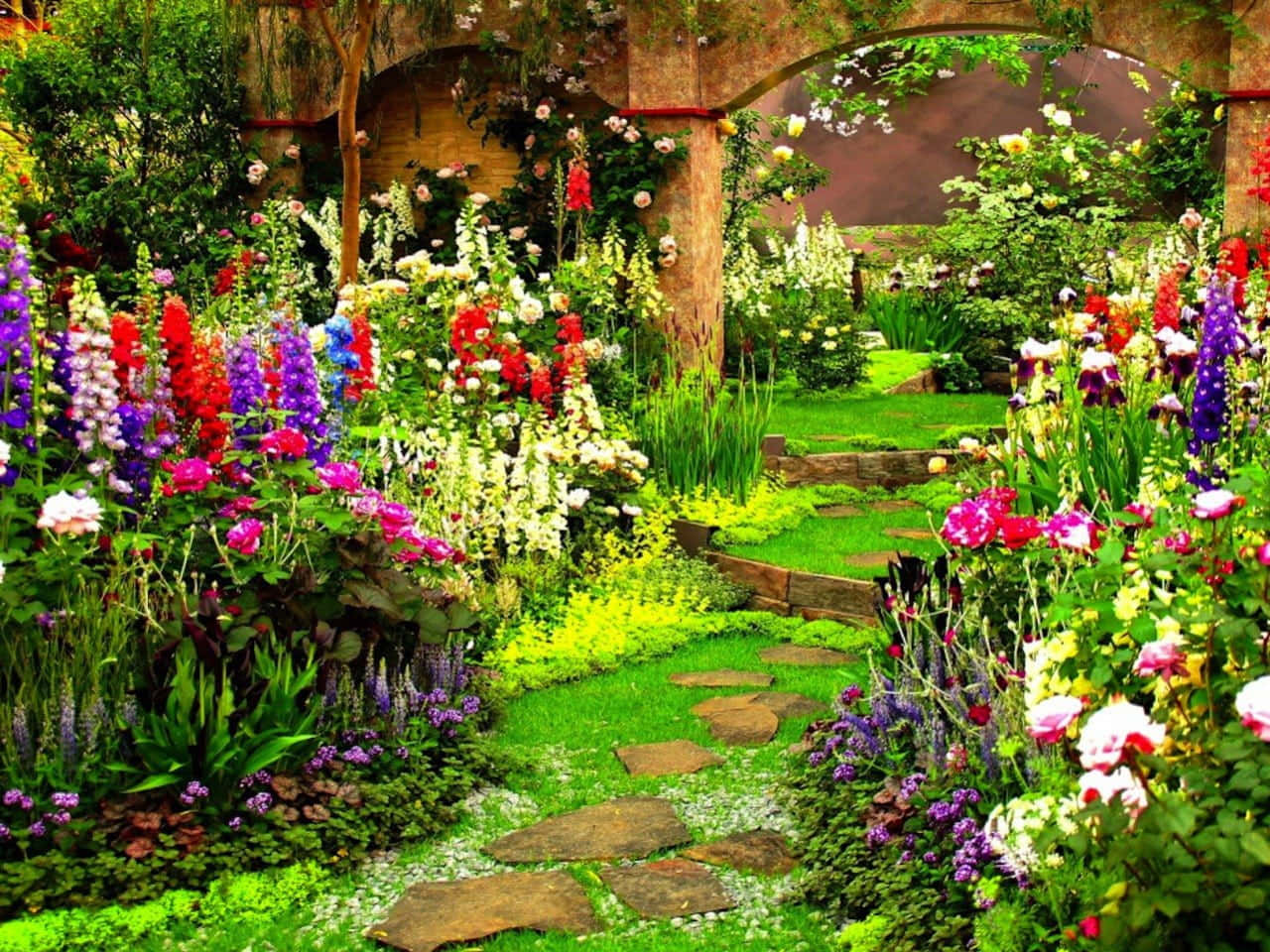 a garden with many colorful flowers and a pathway