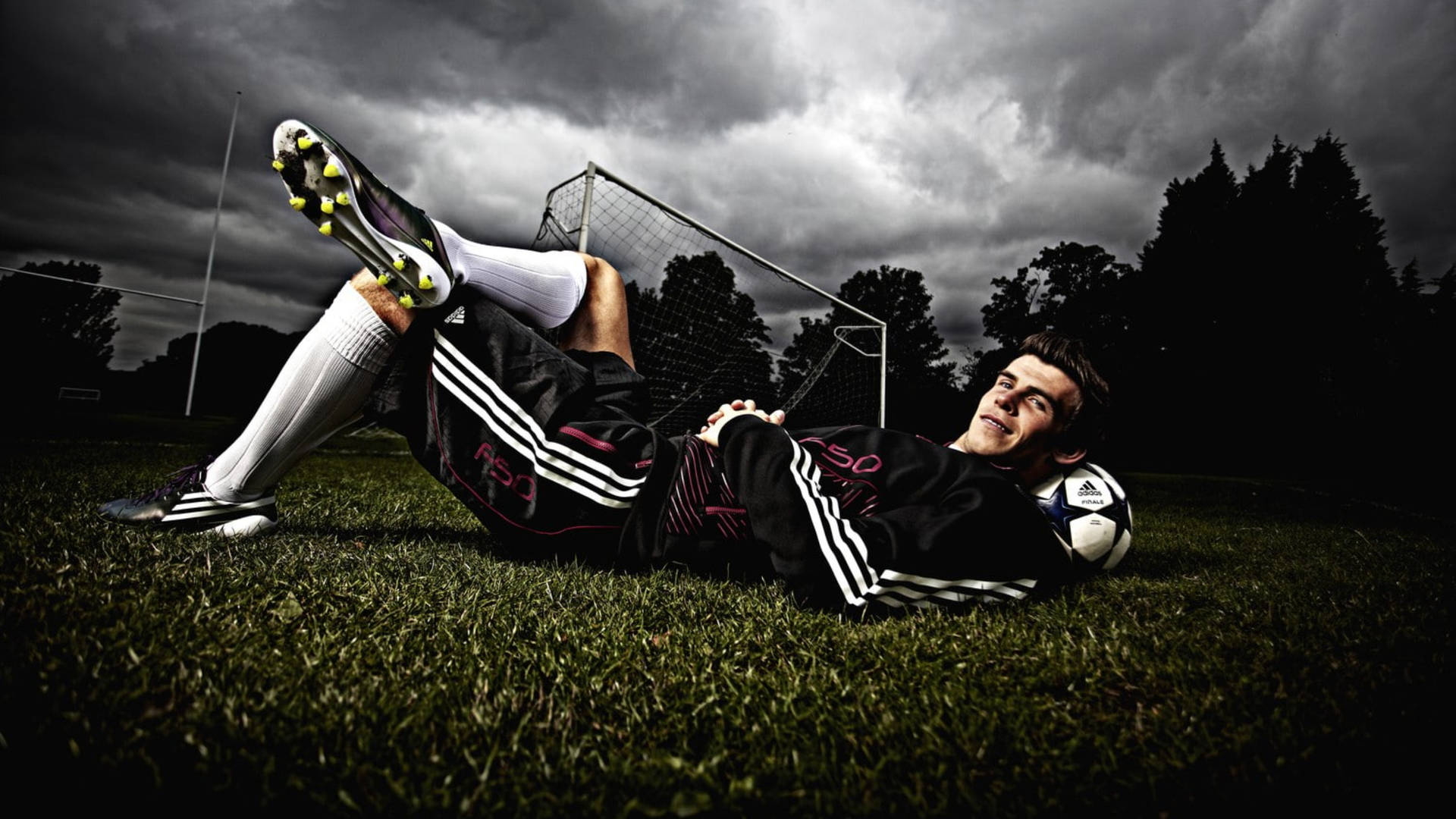 Gareth Bale Lying In Field Wallpaper
