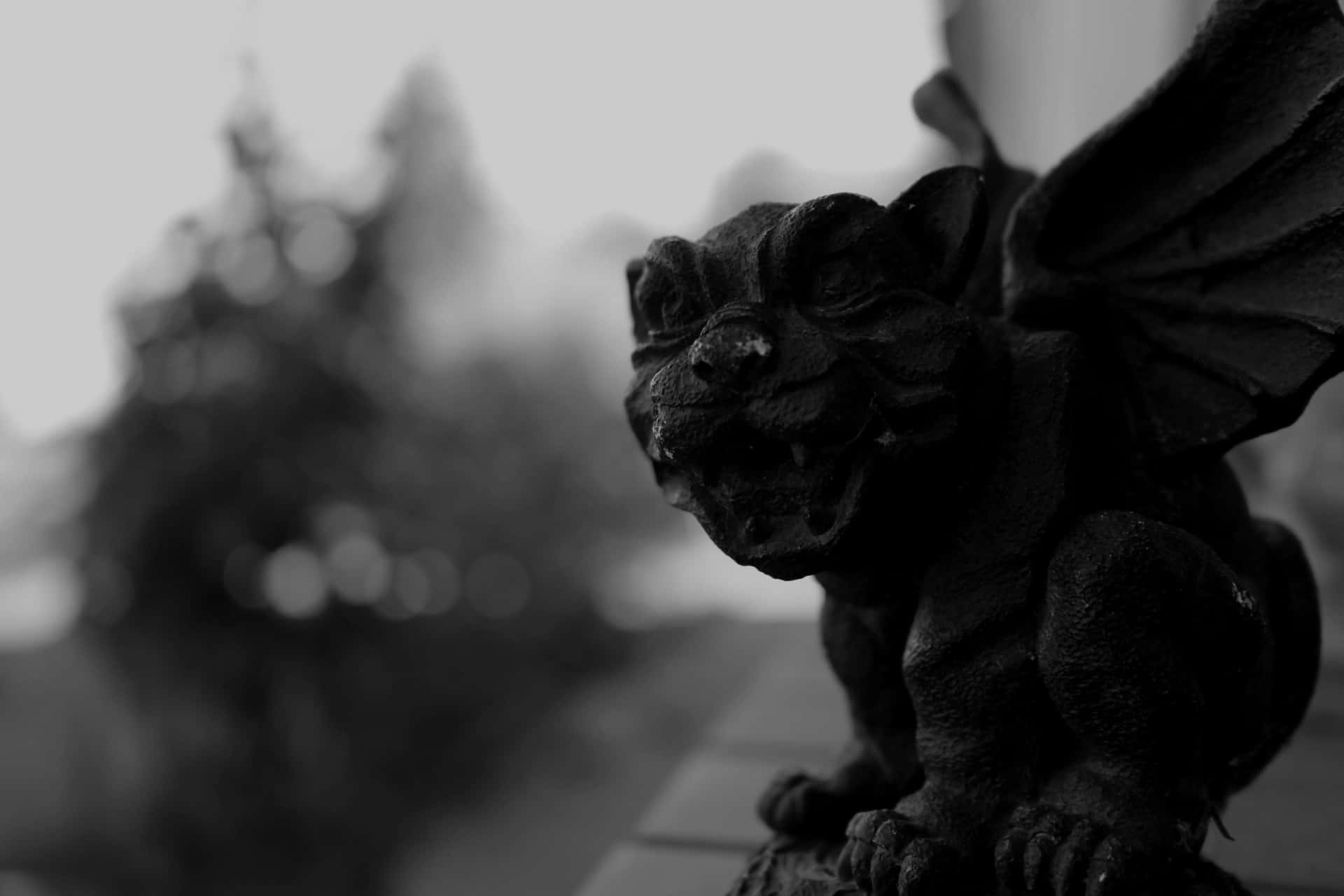 A gothic gargoyle firmly perched atop an ancient building, staring out in all directions.