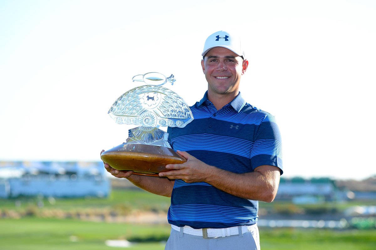 Triumph: Gary Woodland proudly holding his golfing trophy Wallpaper
