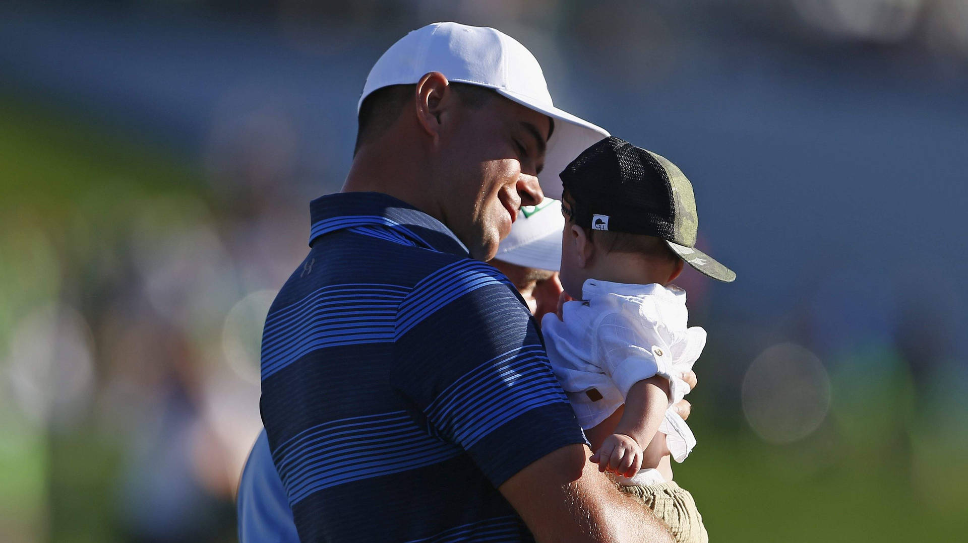 Gary Woodland Holding His Baby Wallpaper