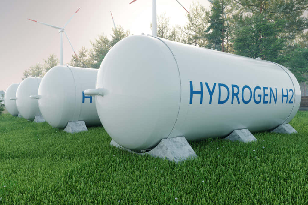 Wasserstoffh2-tanks Auf Einer Wiese Mit Windkraftanlagen