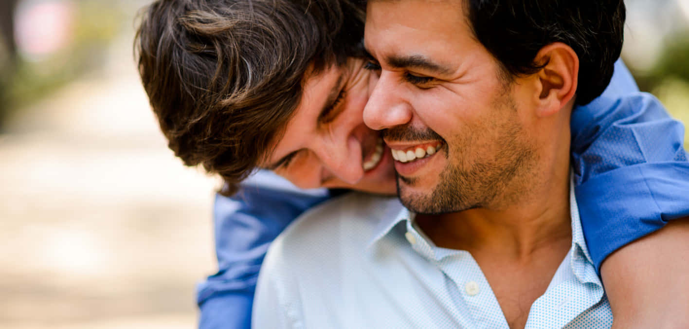 Gay Latino Couple Hugging Wallpaper