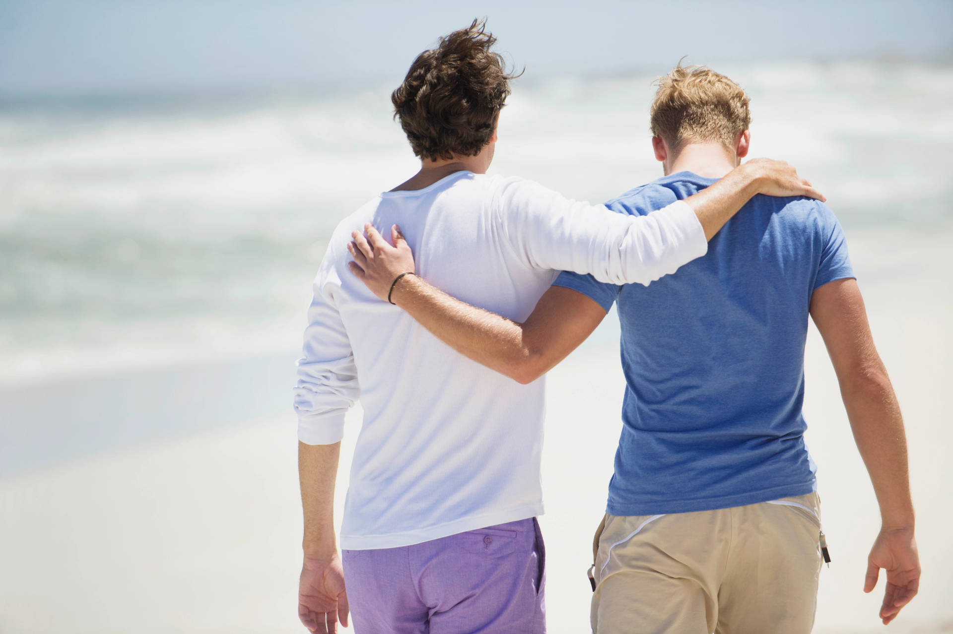 Gay Men Walking On Beach Wallpaper