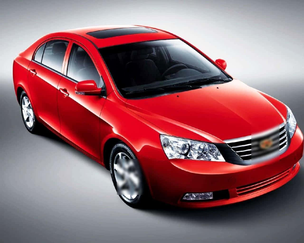Sleek Geely car on a scenic road Wallpaper