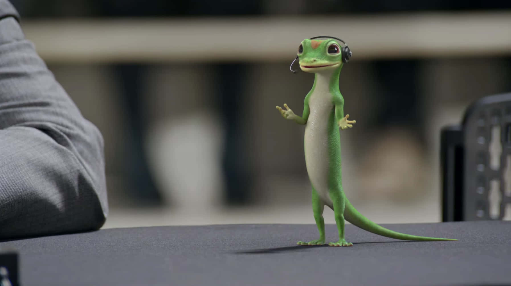 A Gecko Is Standing On A Table