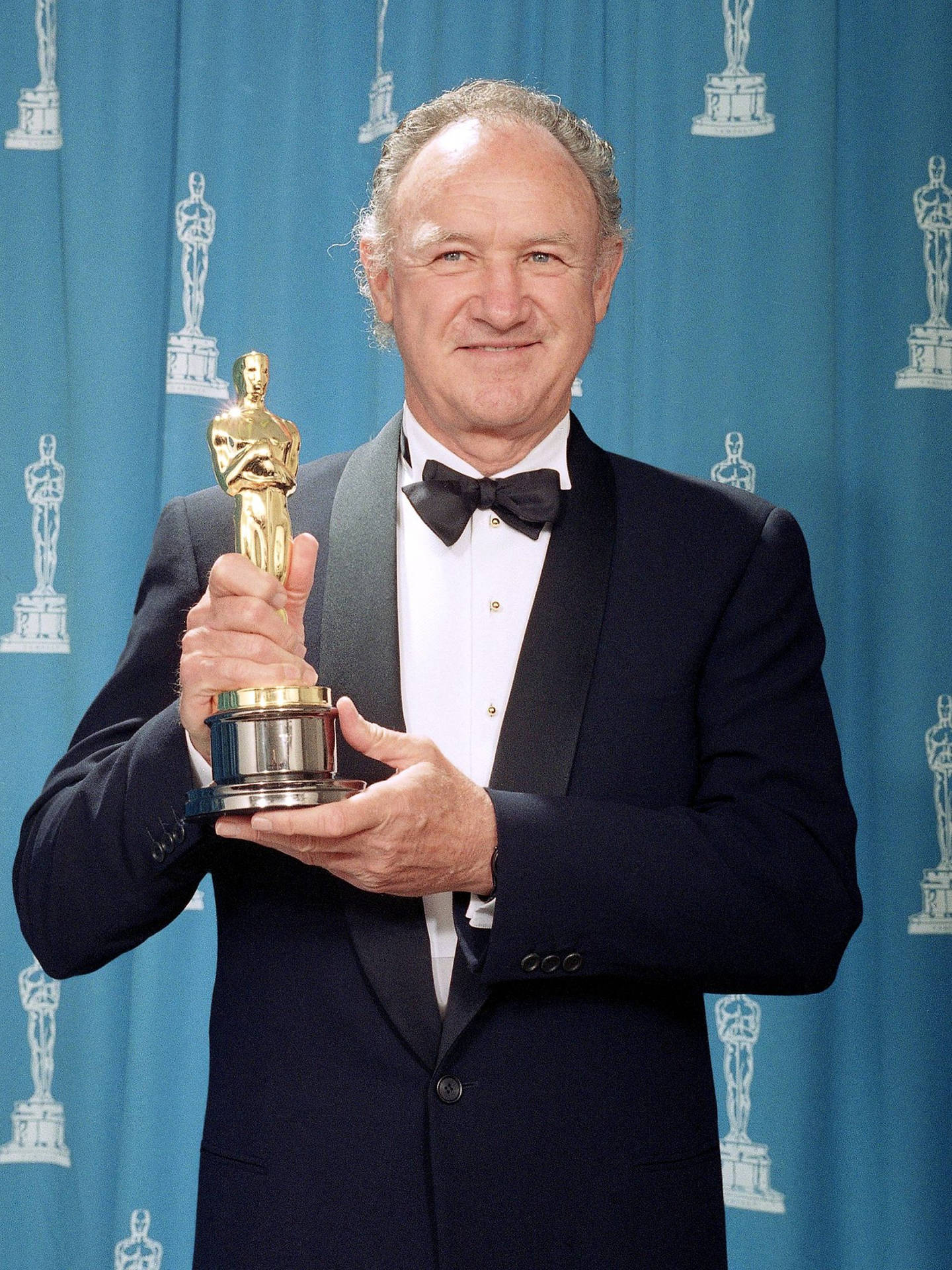 Didyou Know That You Can Transform Your Computer Or Mobile Wallpaper Into A Tribute To The Legendary Actor Gene Hackman? Celebrate His Illustrious Career And Impressive Collection Of Oscars With A Captivating Wallpaper. Sfondo