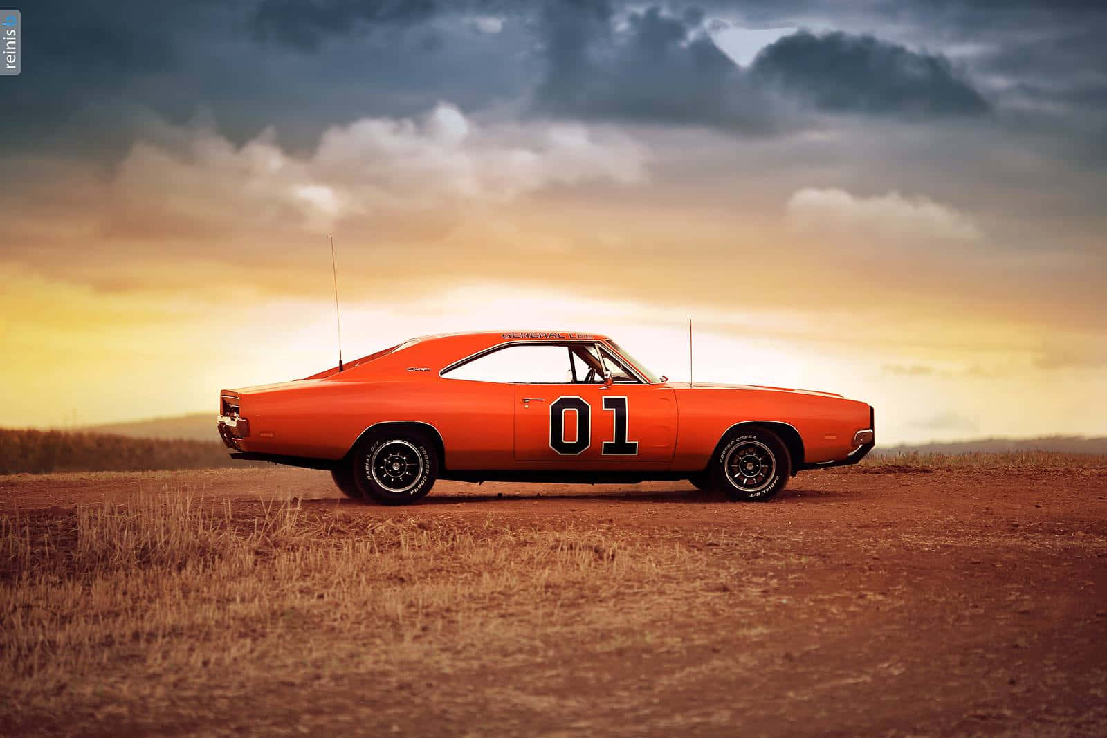 Et orange musclebil holder parkeret i ørkenen Wallpaper