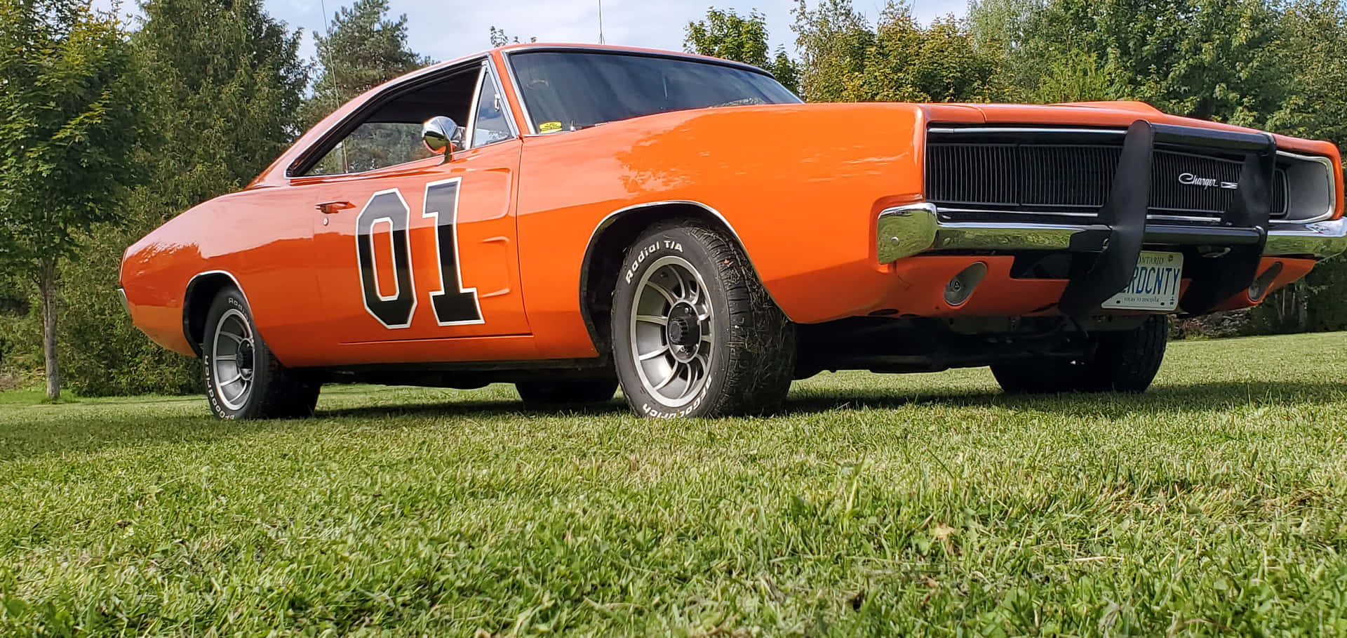 General Lee Car Parked On Grass Wallpaper