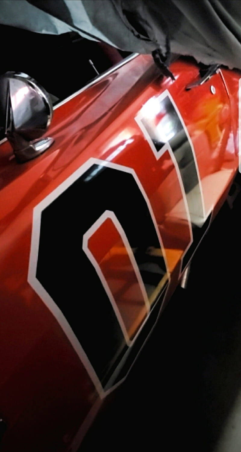 A Red Car With A Number On It Wallpaper