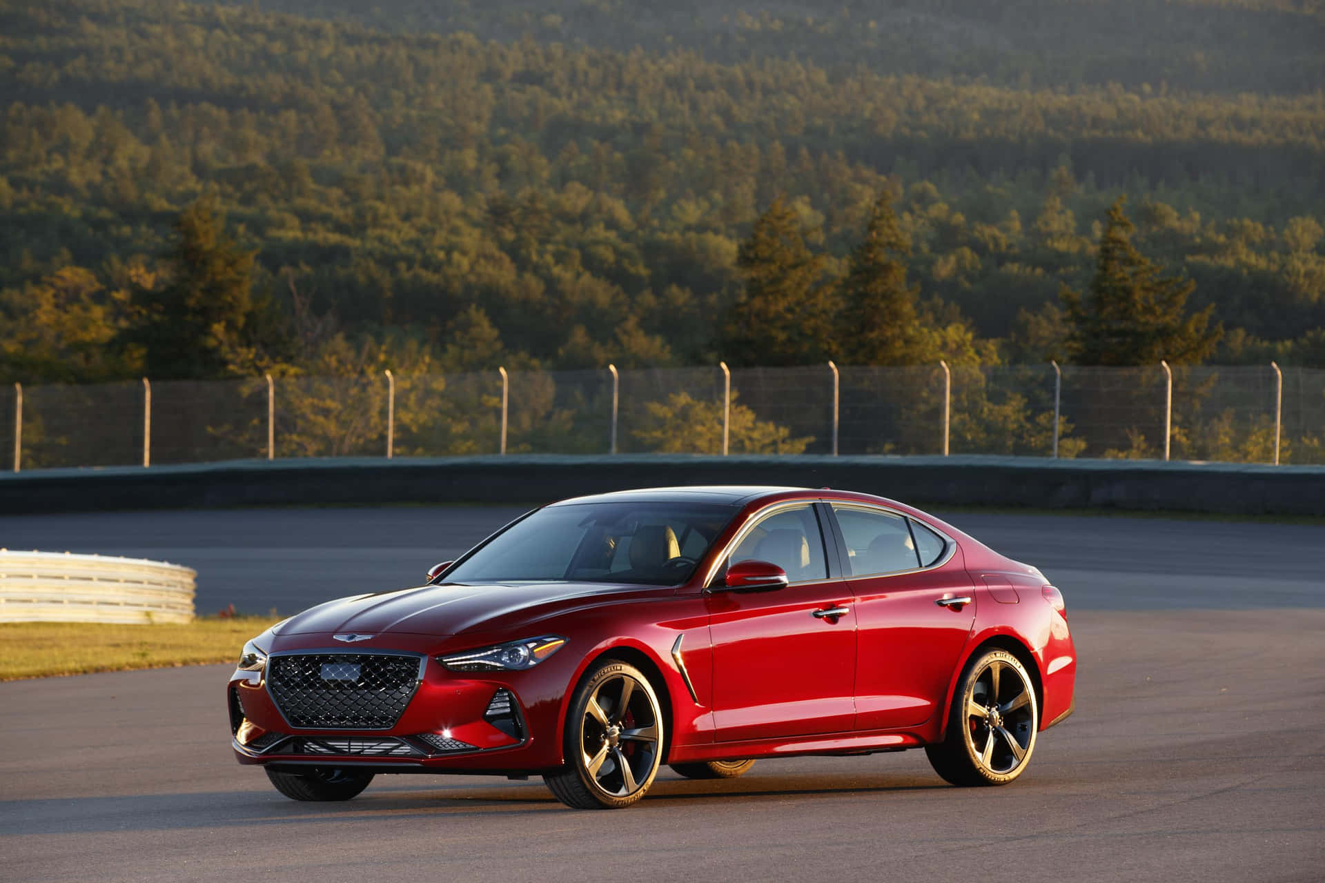 Sleek and Stylish Genesis G70 in Action Wallpaper