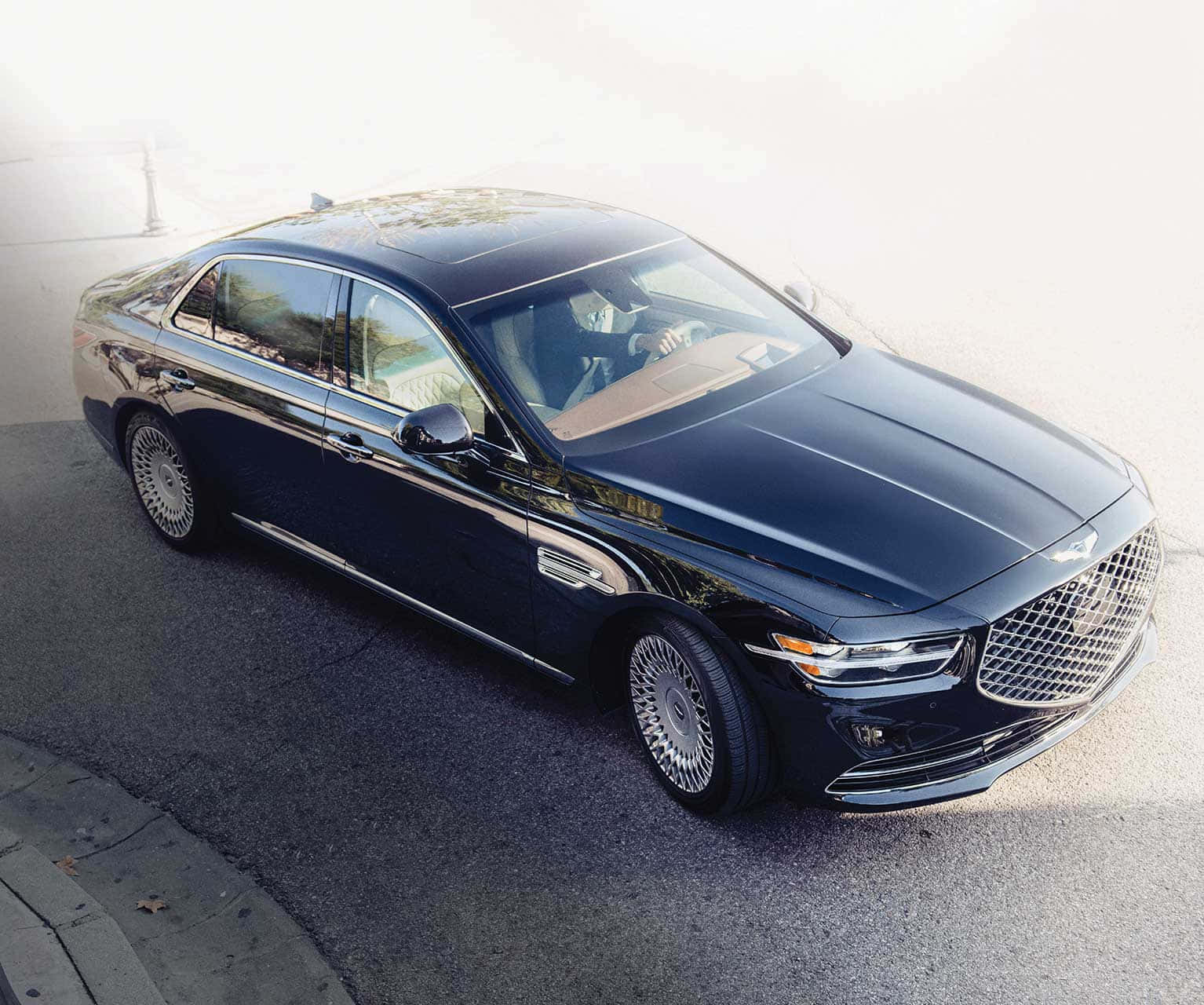 Stylish Genesis G90 Luxury Sedan on the Road Wallpaper