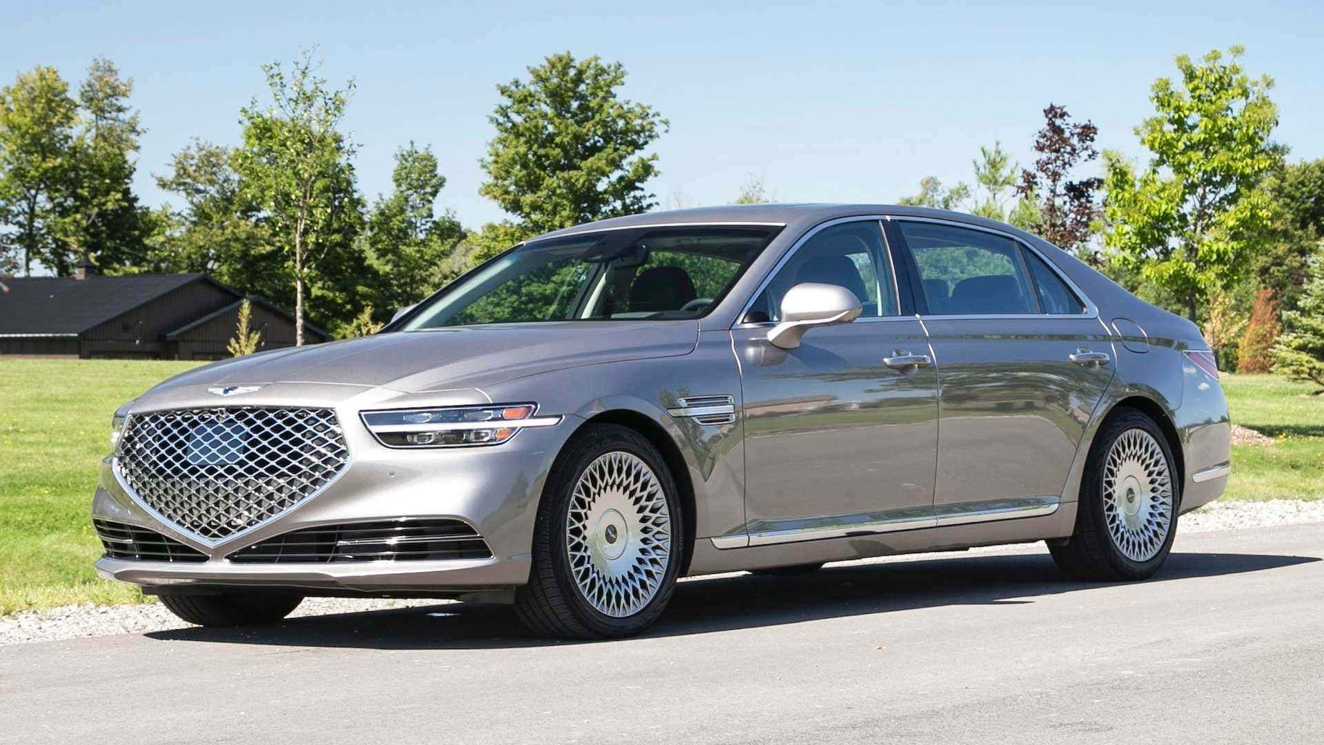 Luxury Redefined: The Genesis G90 in Elegant Maroon Wallpaper