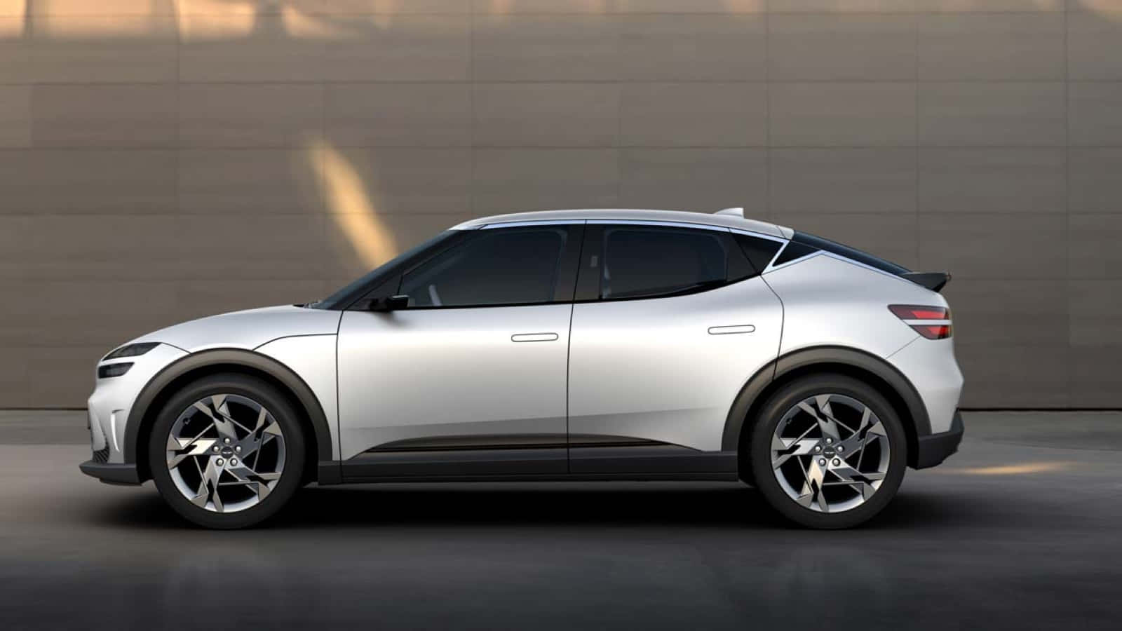 Genesis GV60 Electric SUV in a Luxurious Urban Setting Wallpaper