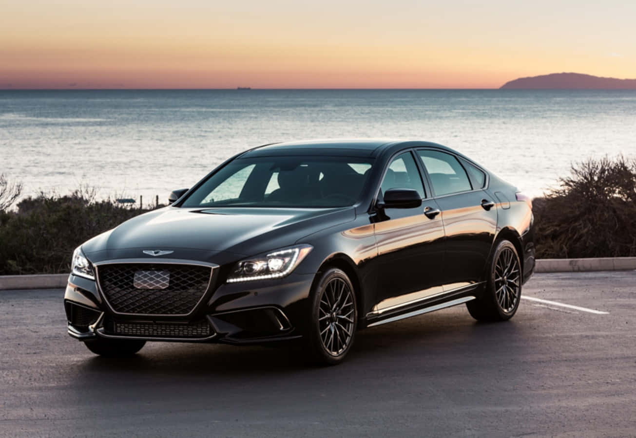 The Black 2019 Genesis Parked In Front Of The Ocean