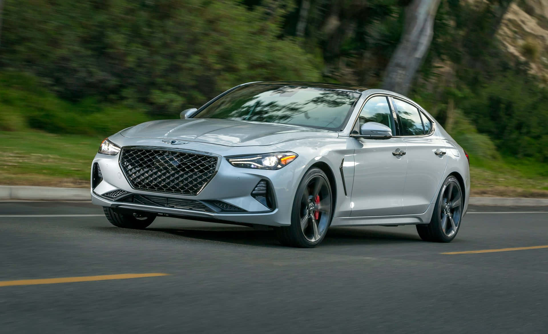 The 2019 Genesis Gt Is Driving Down The Road