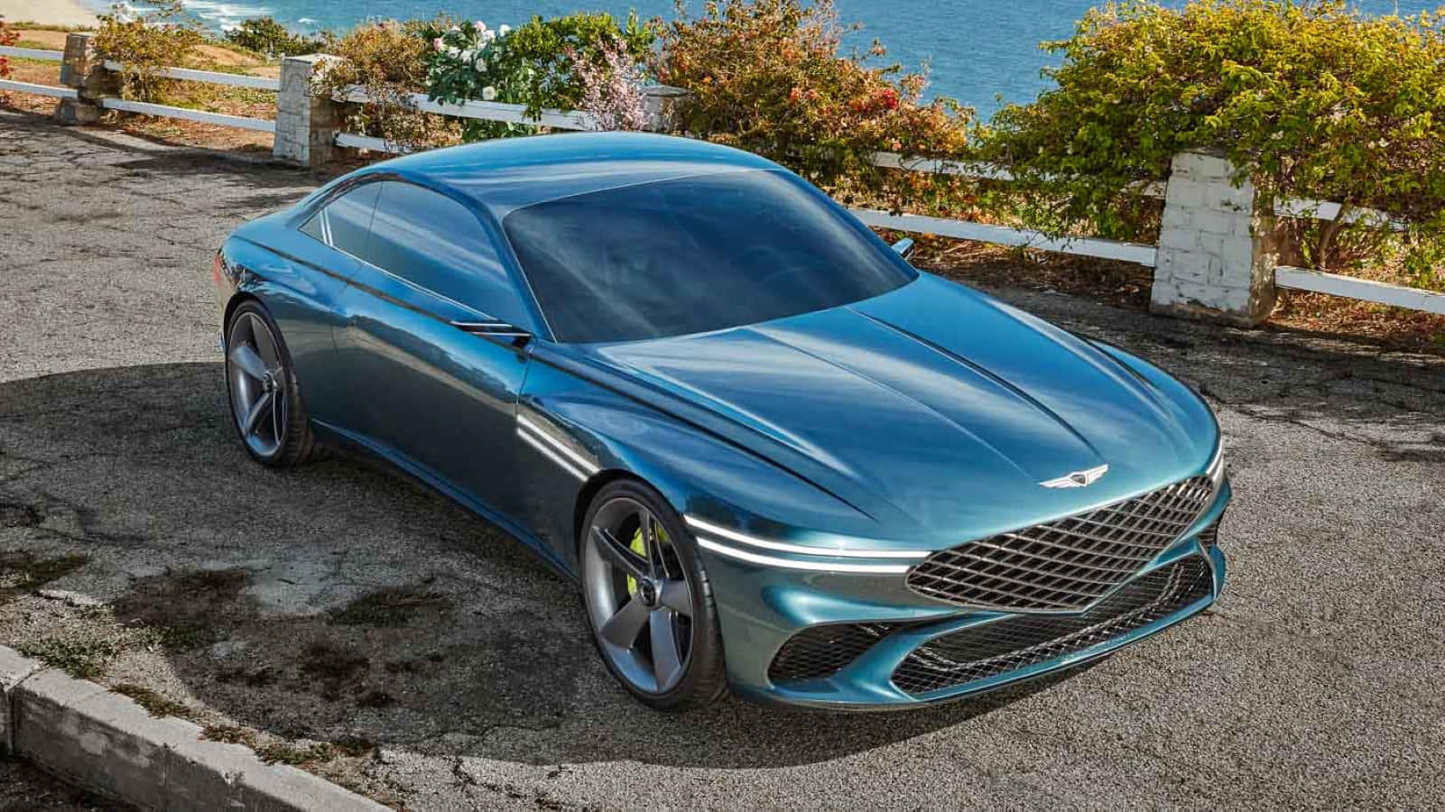 Sleek Genesis X Concept Electric Vehicle on the Road Wallpaper