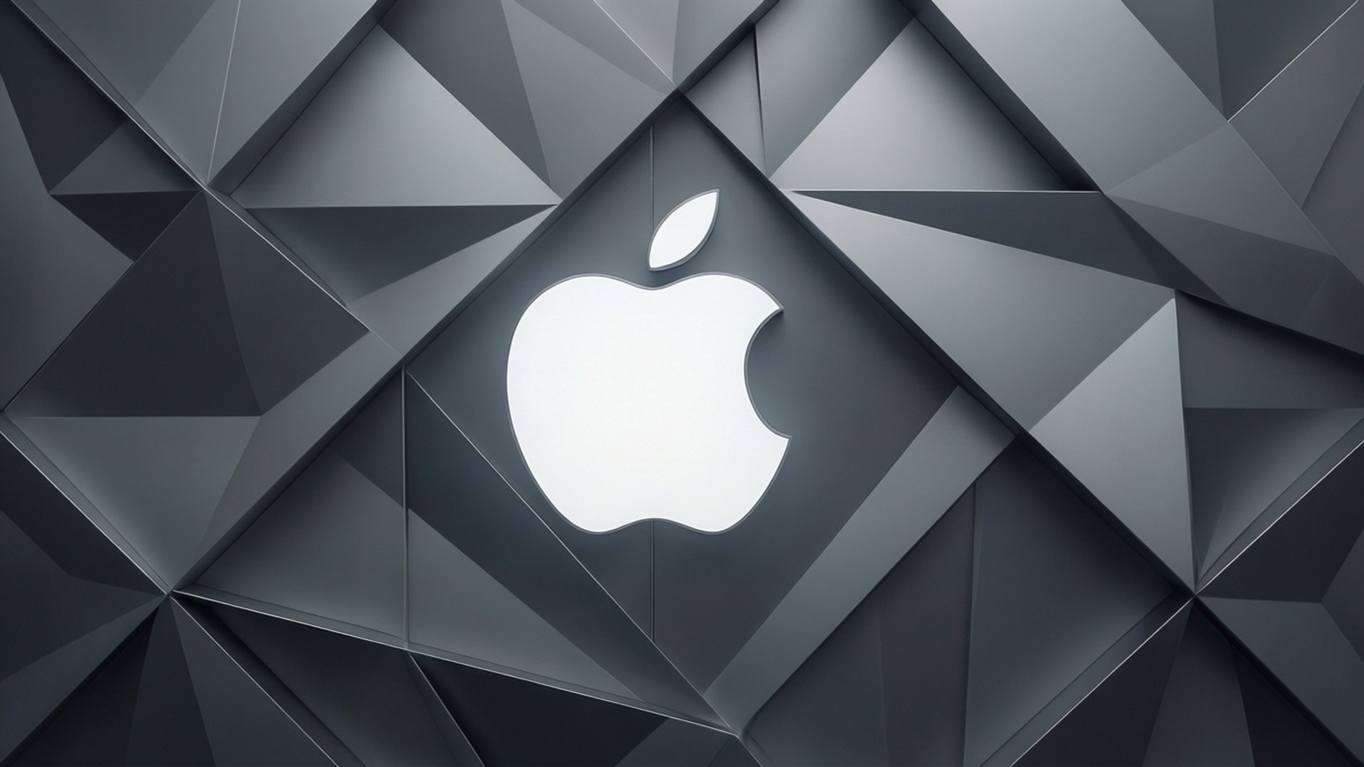 Vit Apple-logotyp på grå geometrisk mönsterbakgrund.