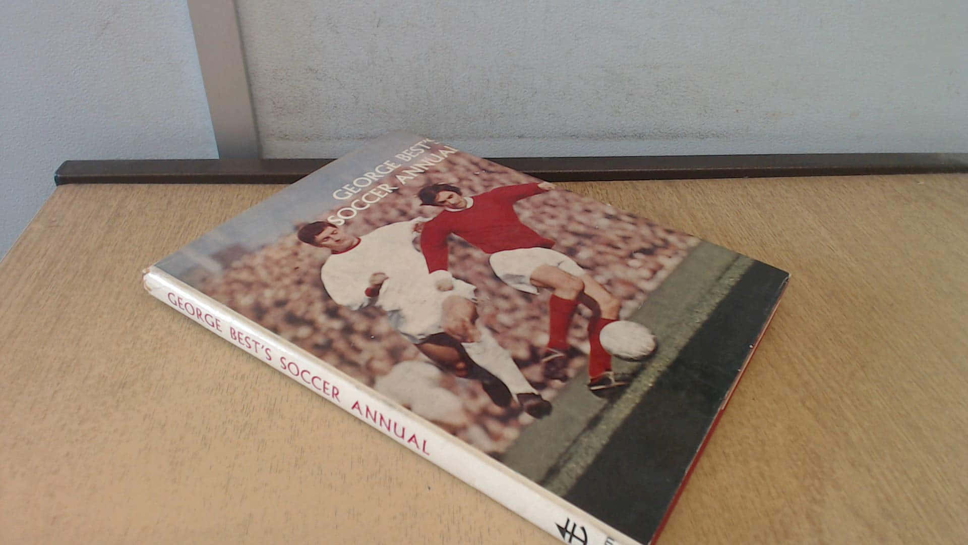 George Best Soccer Annual Book On Table Background