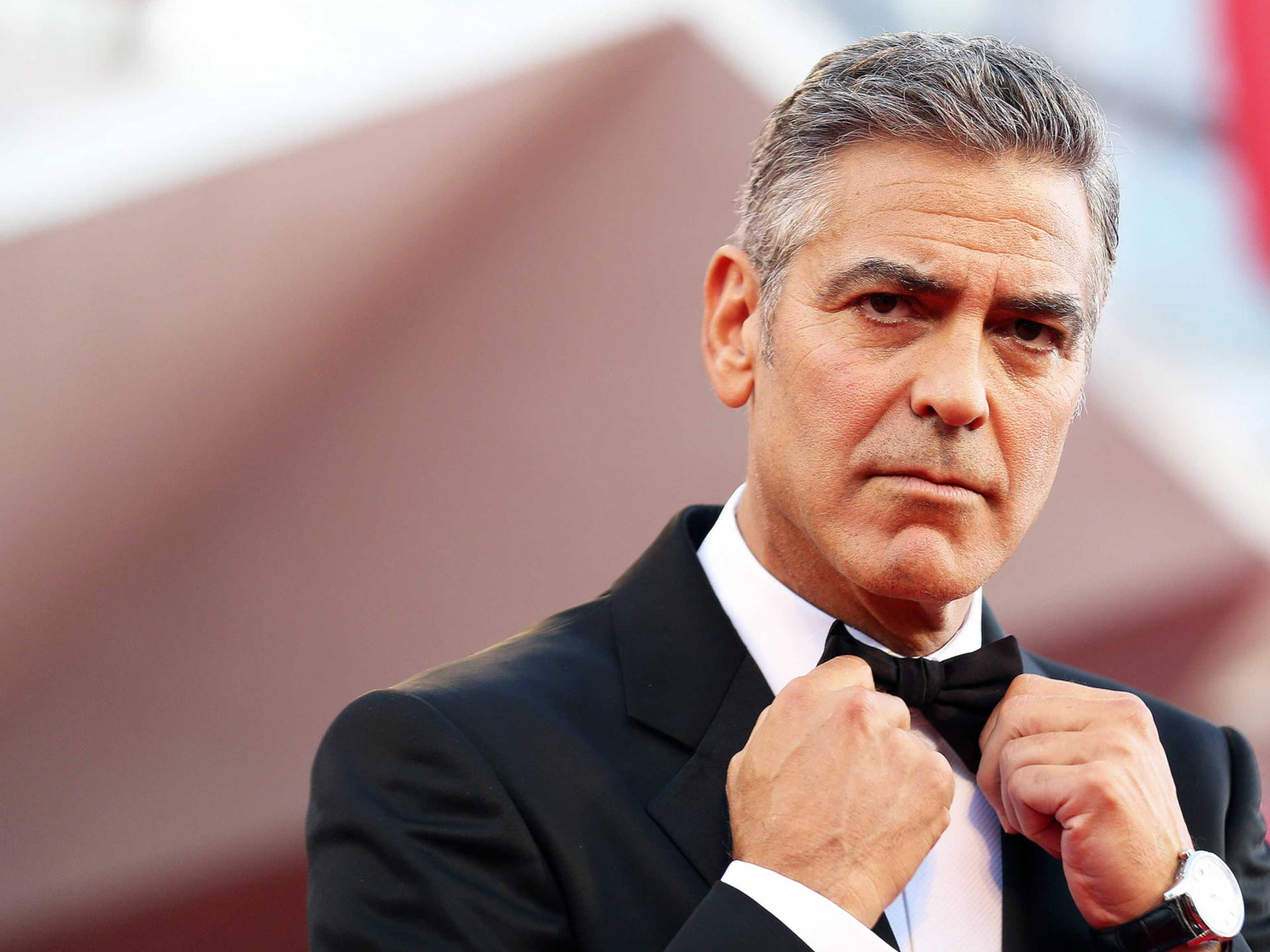 George Clooney Fixing His Bow Tie Wallpaper