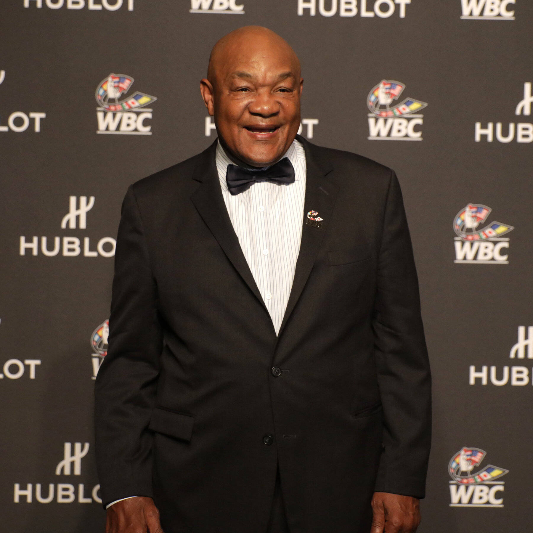 George Foreman In A Suit Wallpaper