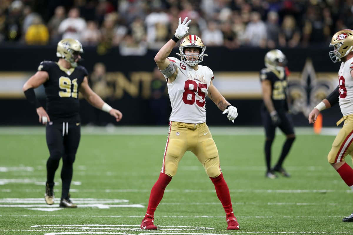 San Francisco 49ers Tight End George Kittle Explodes into the End Zone Wallpaper