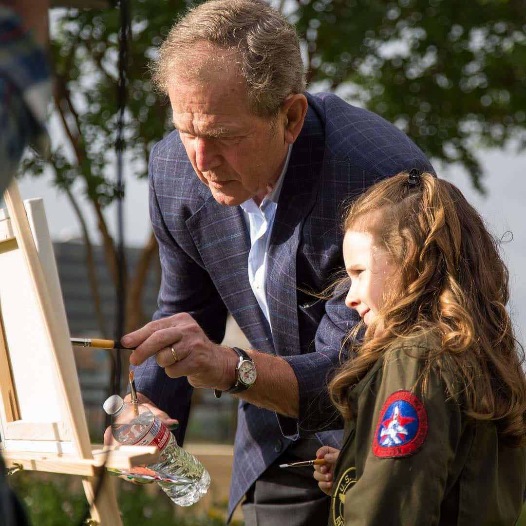 George W. Bush With A Kid Painter Wallpaper