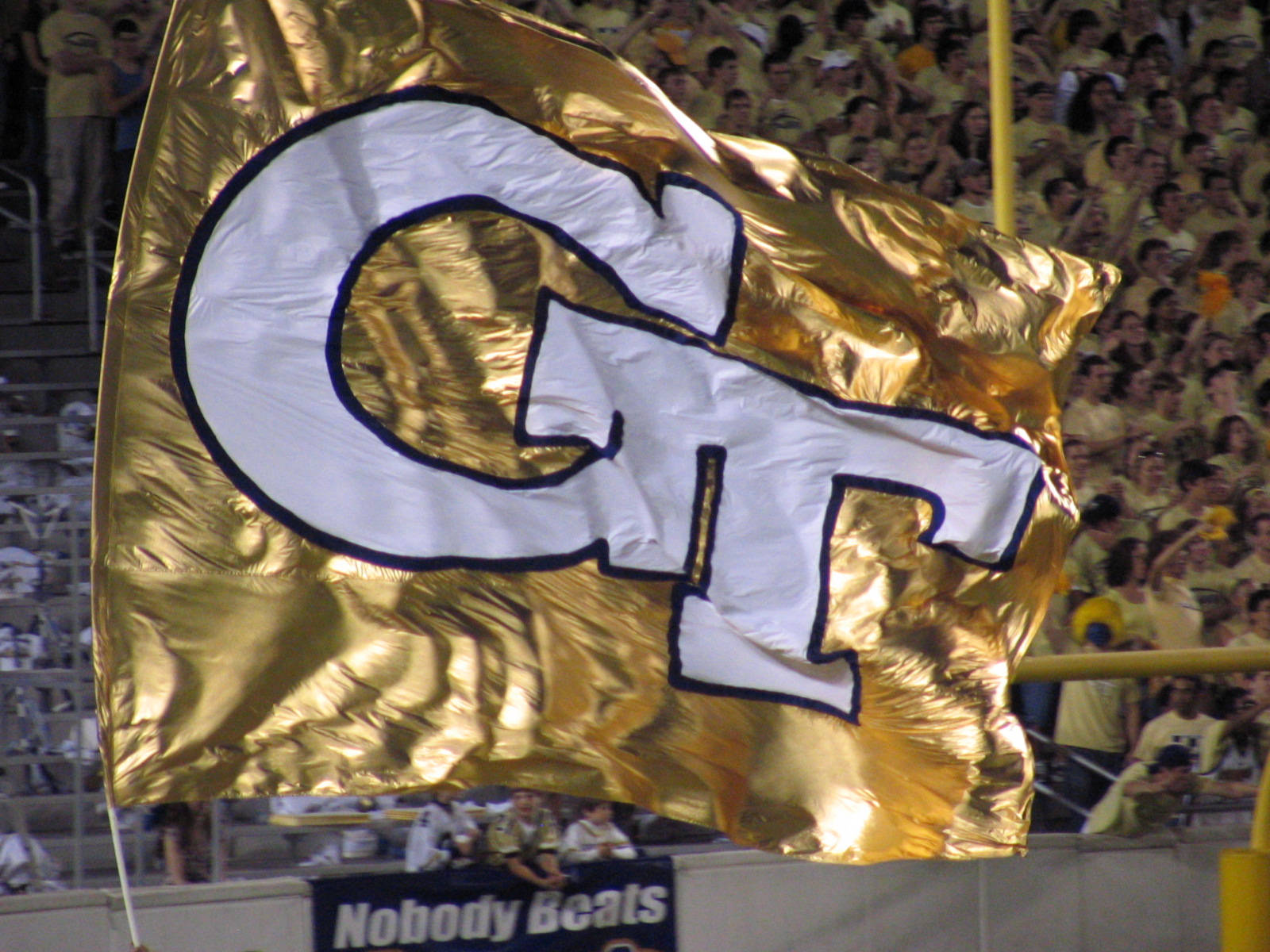 Georgia Tech Gold Banner Draping Elegantly Over the College Architecture Wallpaper