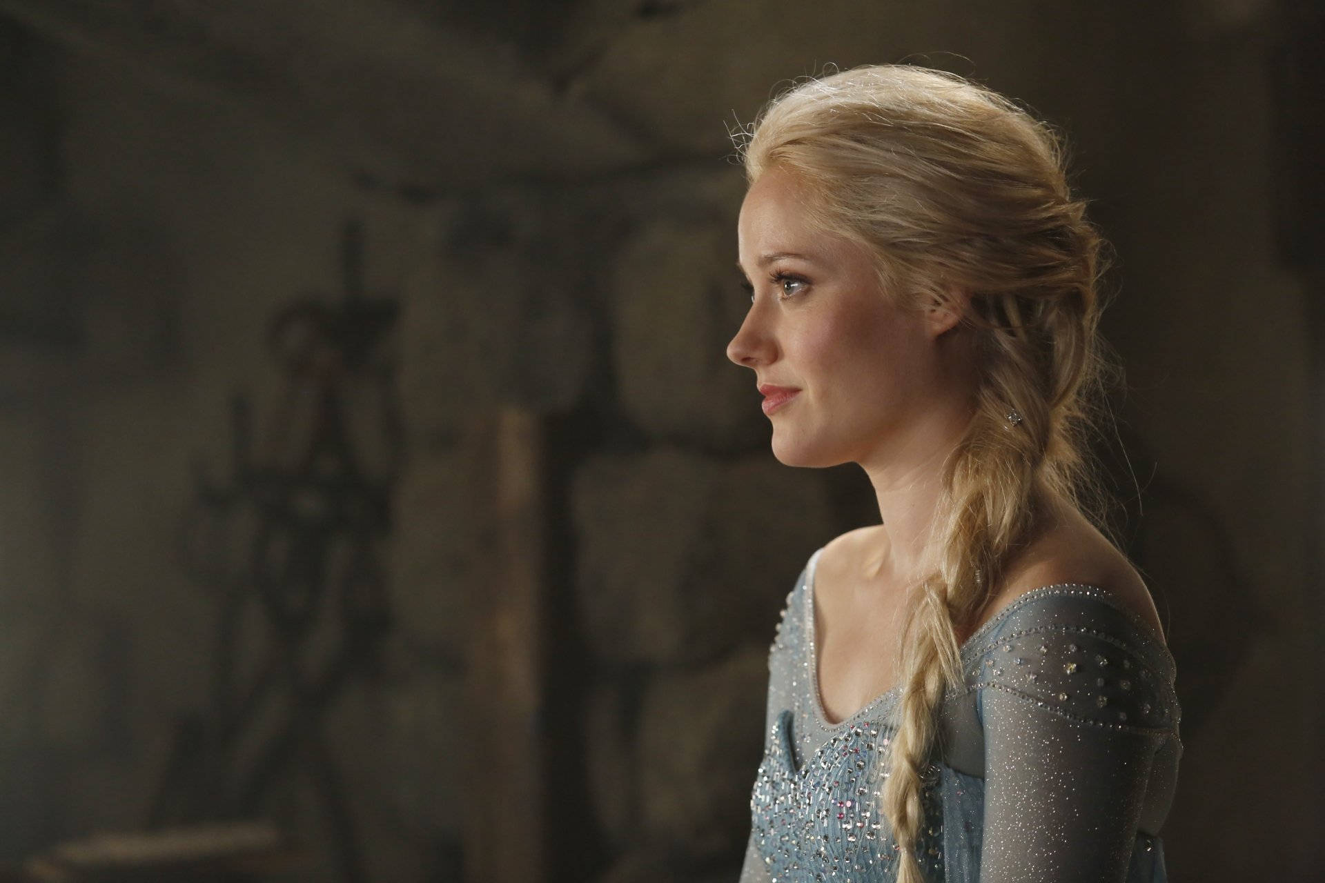Georgina Haig embodying the character of Elsa in a stunning icy blue ensemble Wallpaper