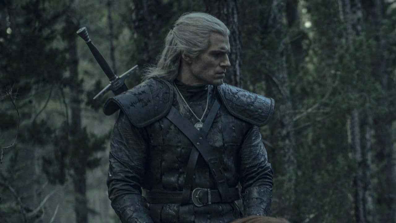 Geralt Of Rivia Battling A Beast Under The Full Moon Wallpaper
