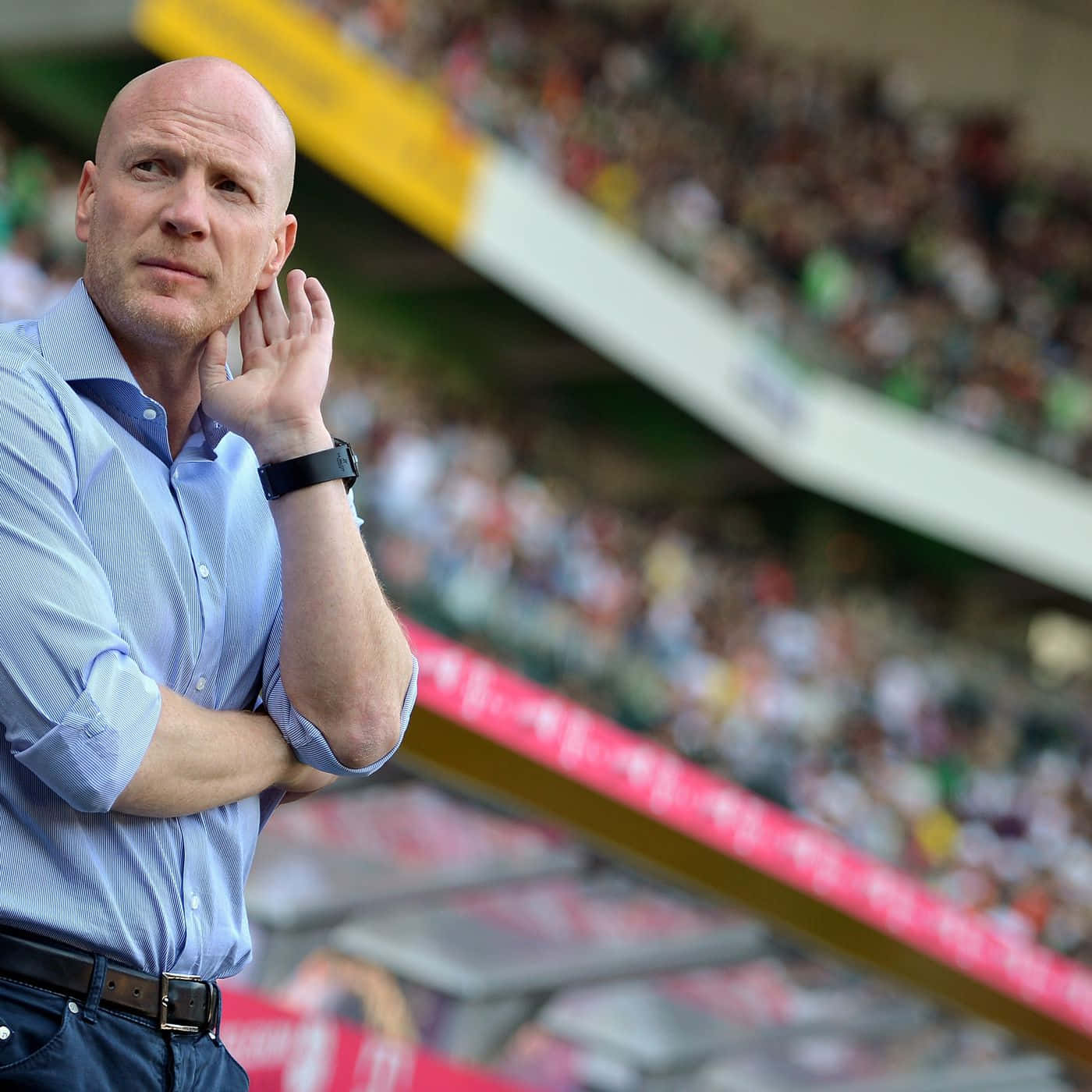 Matthias Sammer, a Renowned German Football Official, Watching the Game Intently from the Sidelines Wallpaper