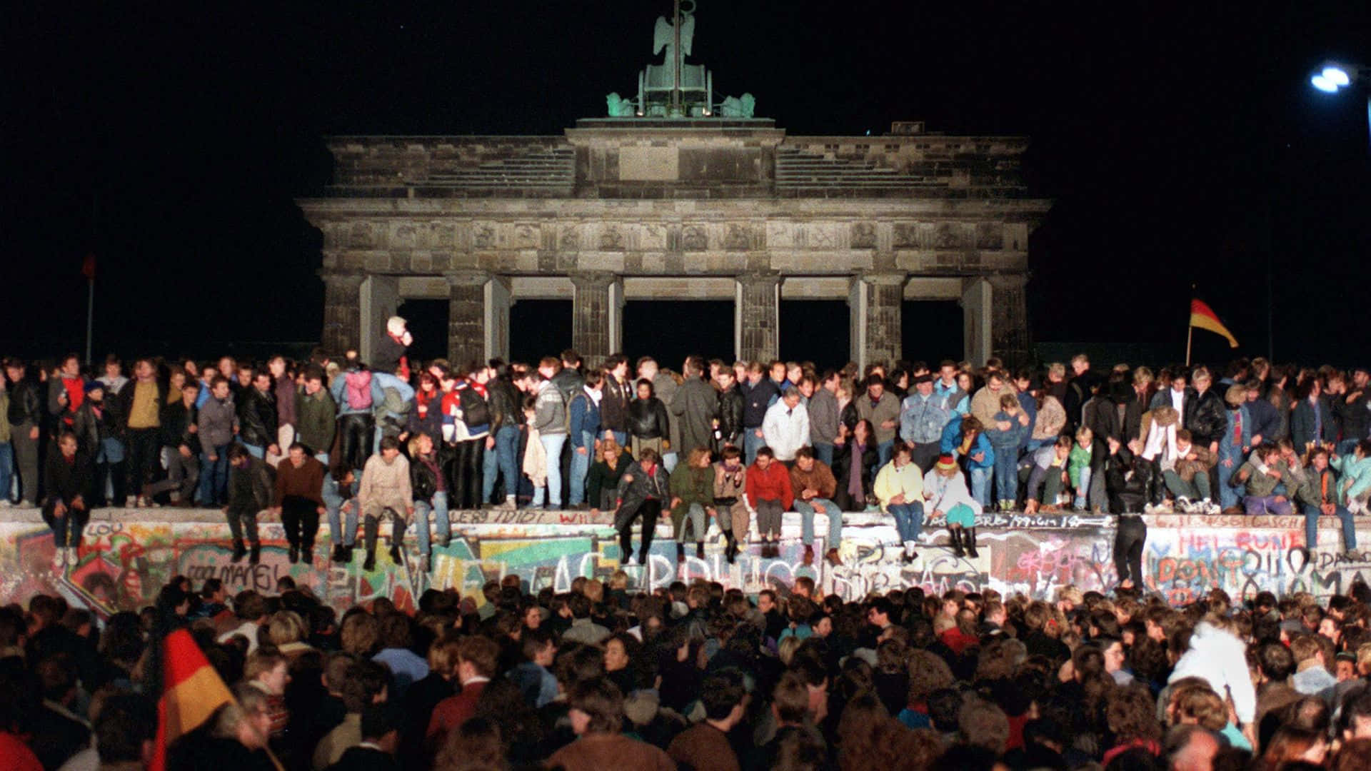 Germans Celebrate During Berlin Wall Opening Wallpaper
