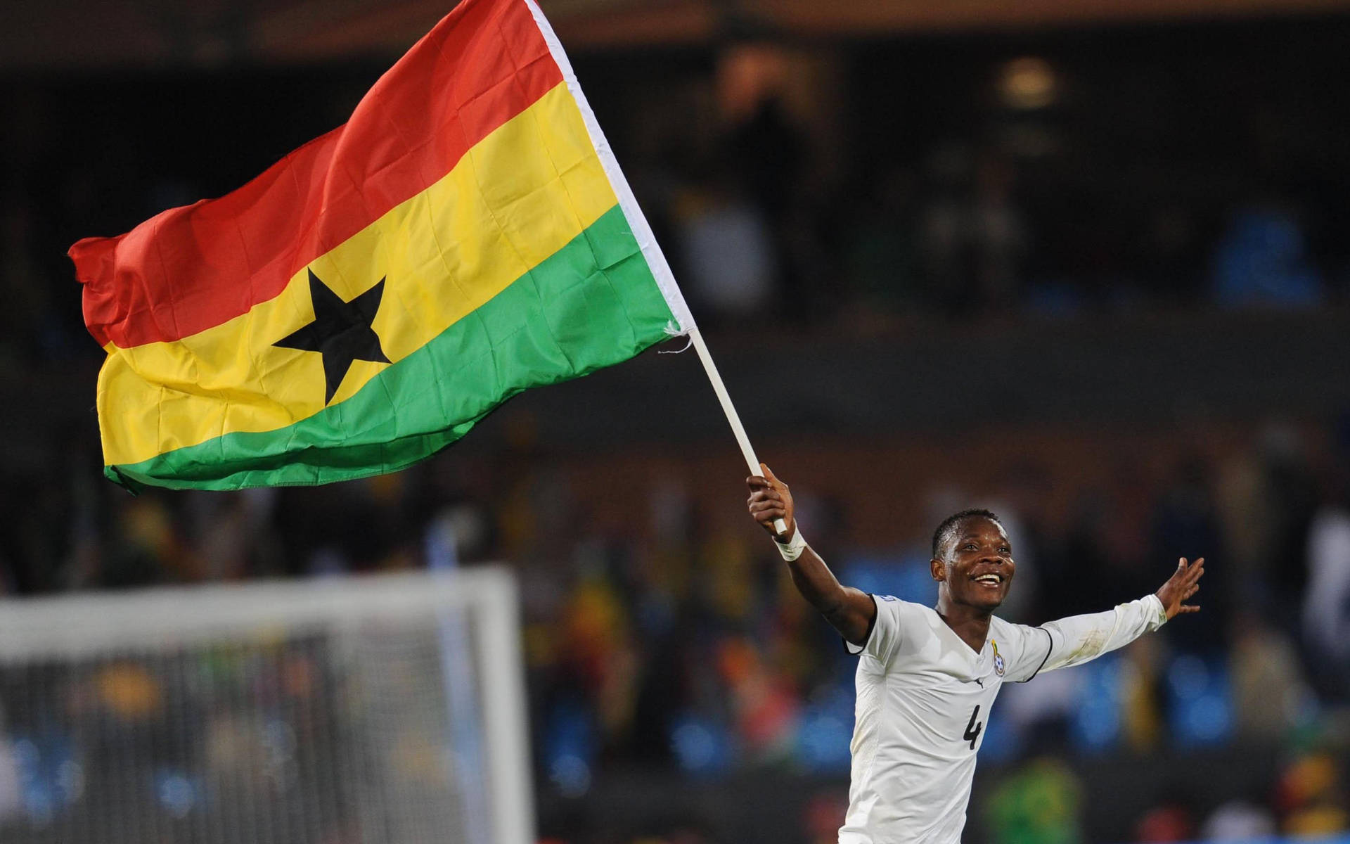 Ghana Atlet Og Flag Wallpaper