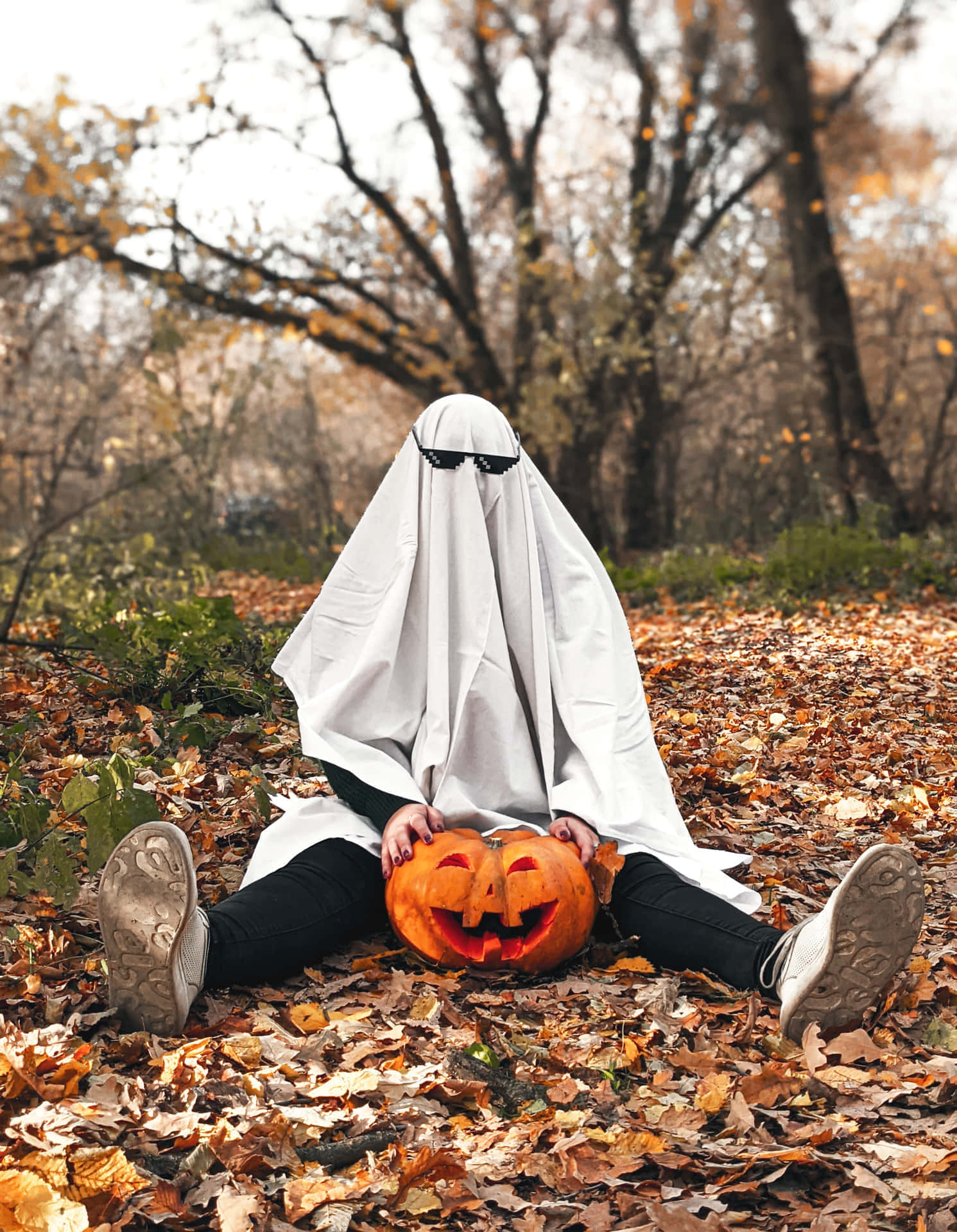 Ghost Costumein Autumn Parkwith Pumpkin Wallpaper