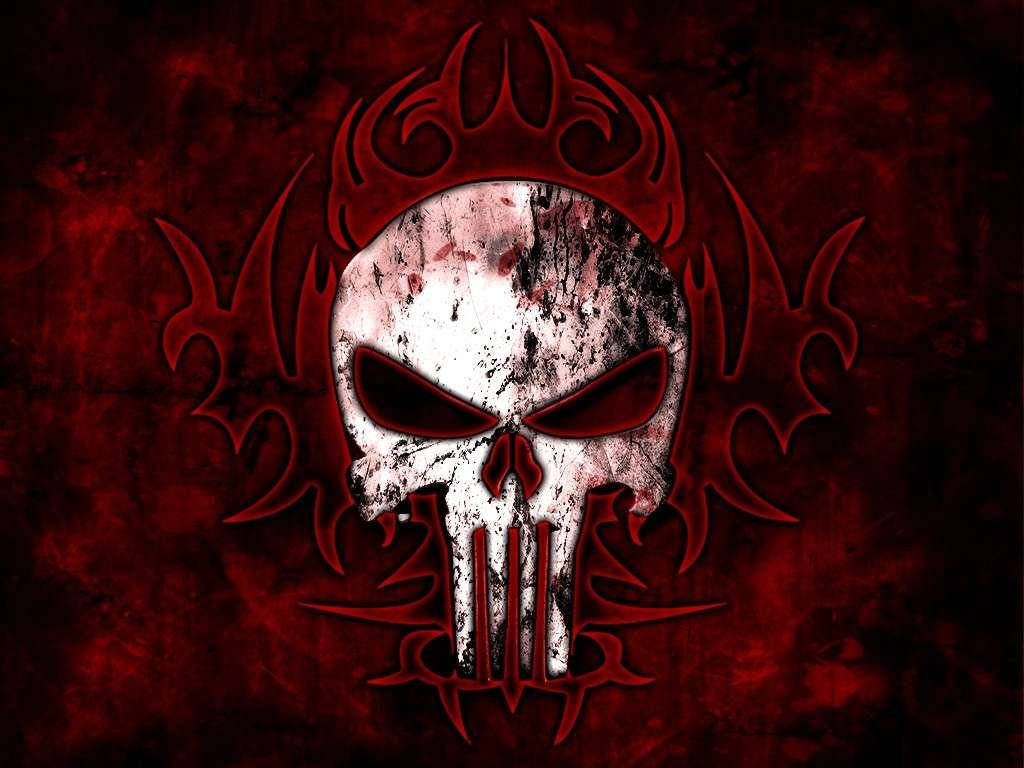 A white skull with dark eyes surrounded by red demon wings. Wallpaper