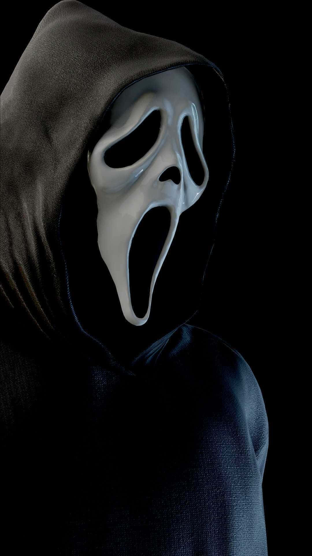 A Man In A Black Hoodie With A White Mask