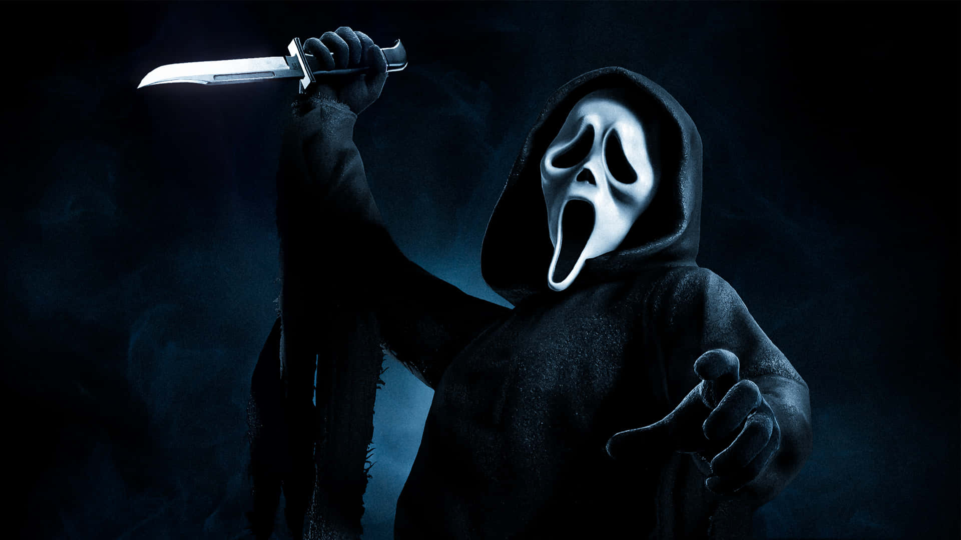 Ghostface stands menacingly atop a mountain of horror movies