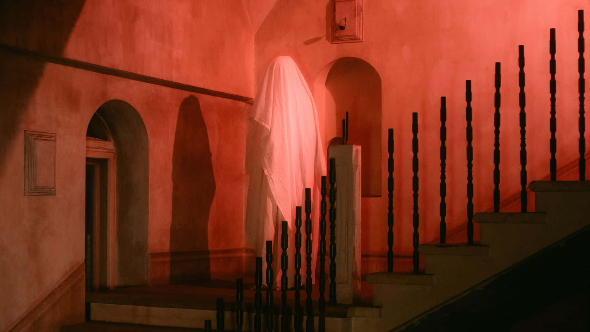 Ghostly_ Presence_in_ Red_ Hues Wallpaper