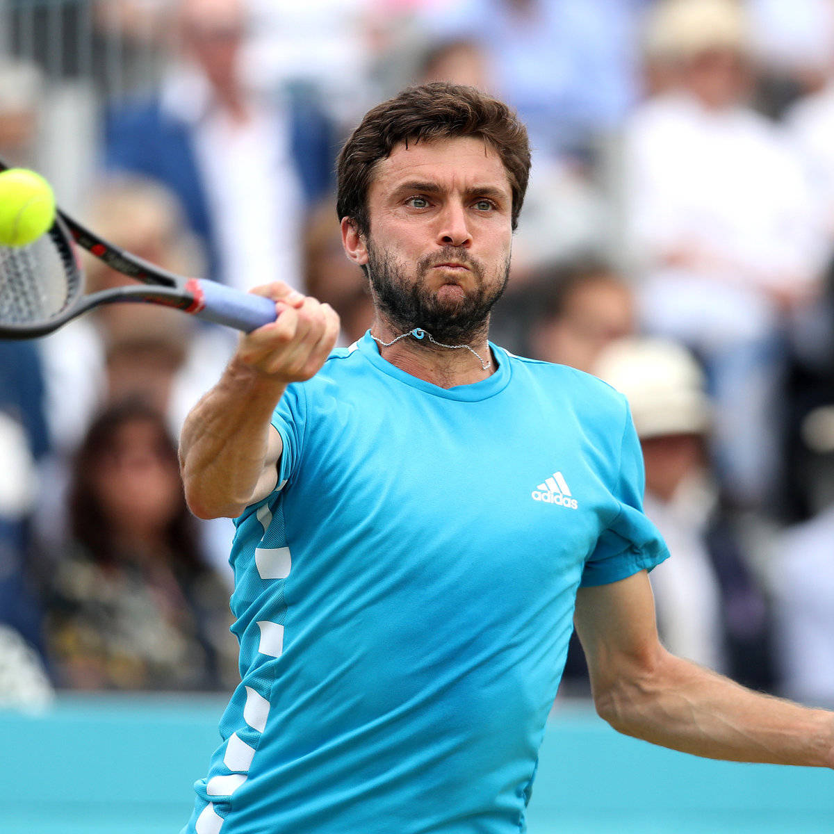 Gilles Simon in action during a professional tennis match. Wallpaper