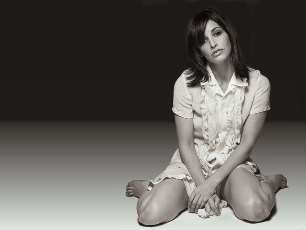 Caption: Actress Gina Gershon striking a pose Wallpaper