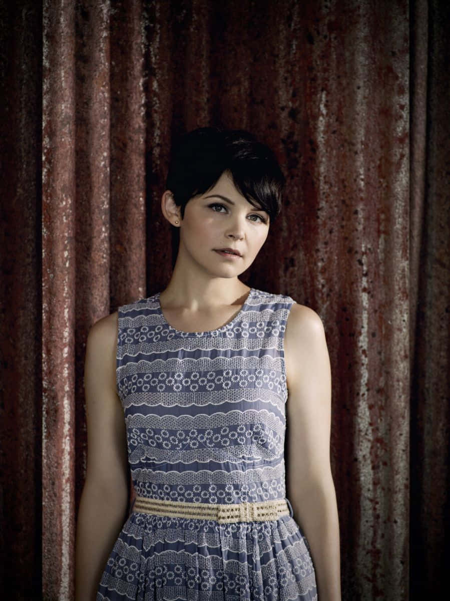 Ginnifer Goodwin striking a pose in a stylish outfit Wallpaper